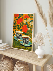 Floral tea cup poster with two dark blue patterned cups and saucers against an orange background with red flowers and green leaves. - Image 4