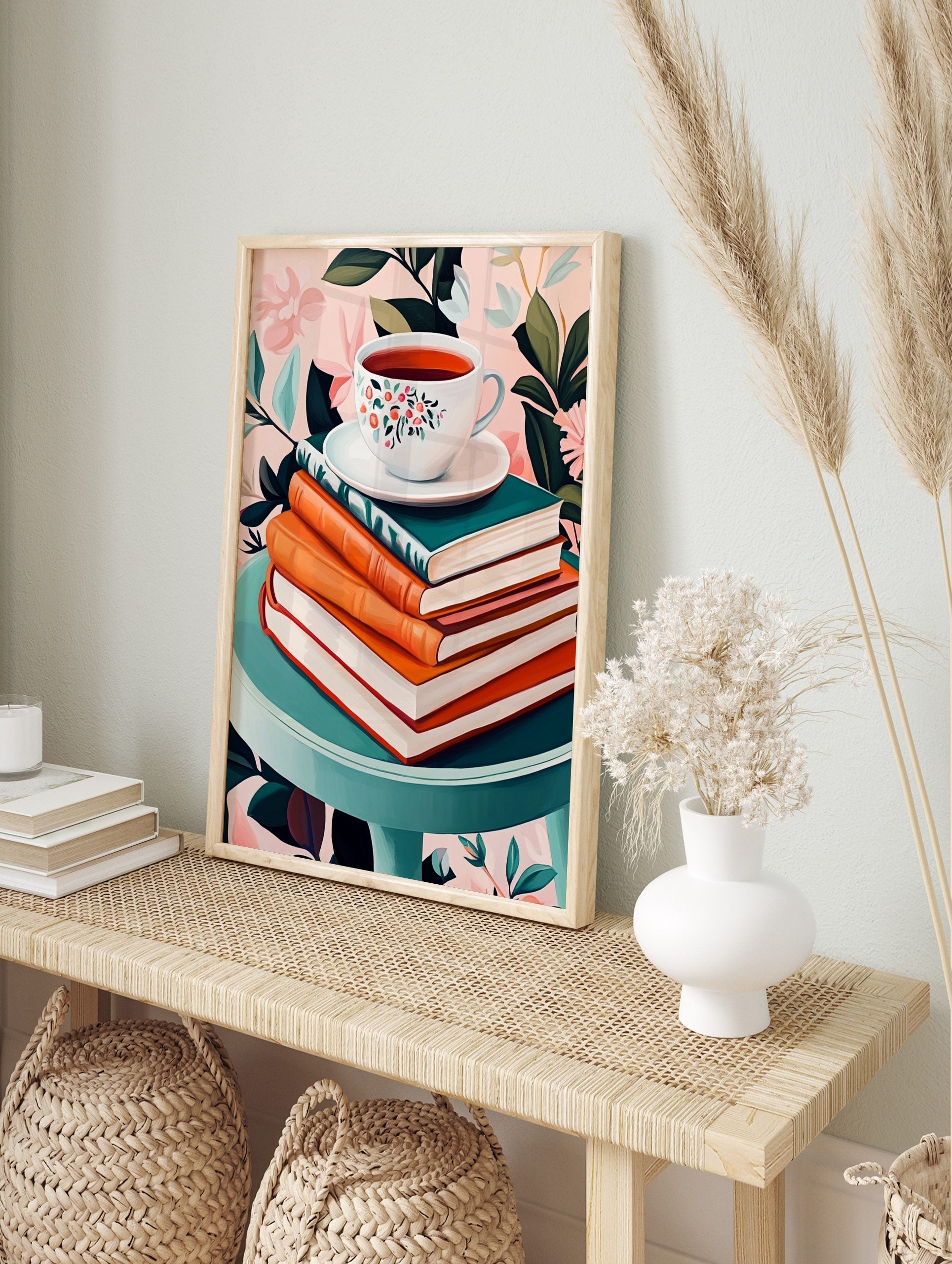 Floral teacup on saucer, stacked books, teal table, pink botanical background still life print, in an alternate framed mockup