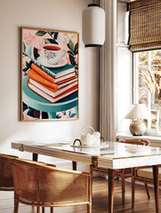Floral teacup on saucer, stacked books, teal table, pink botanical background still life print, in a styled room mockup