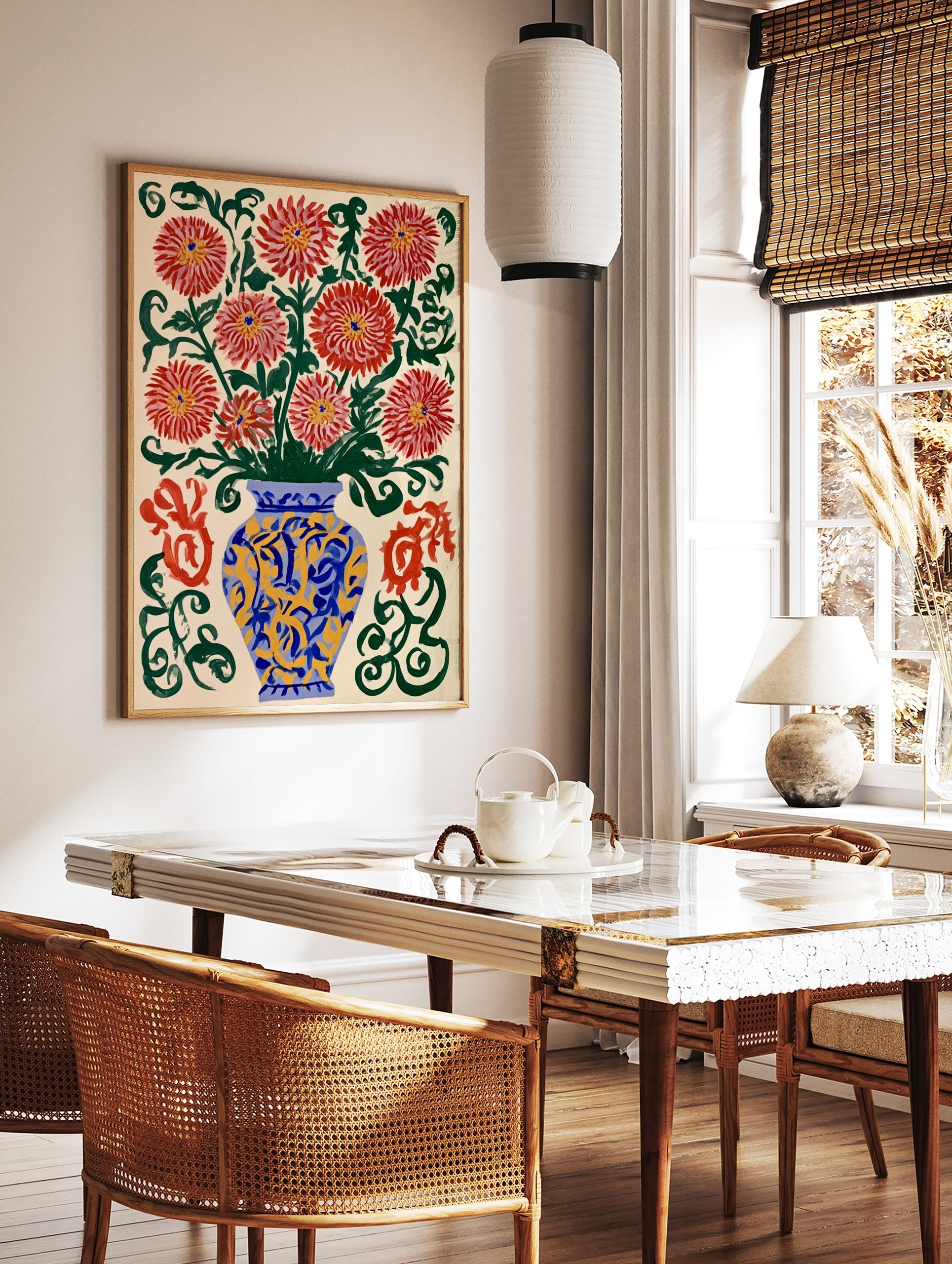 Illustrative red chrysanthemum flowers in a blue and yellow vase with green swirls on a cream, in a styled room mockup