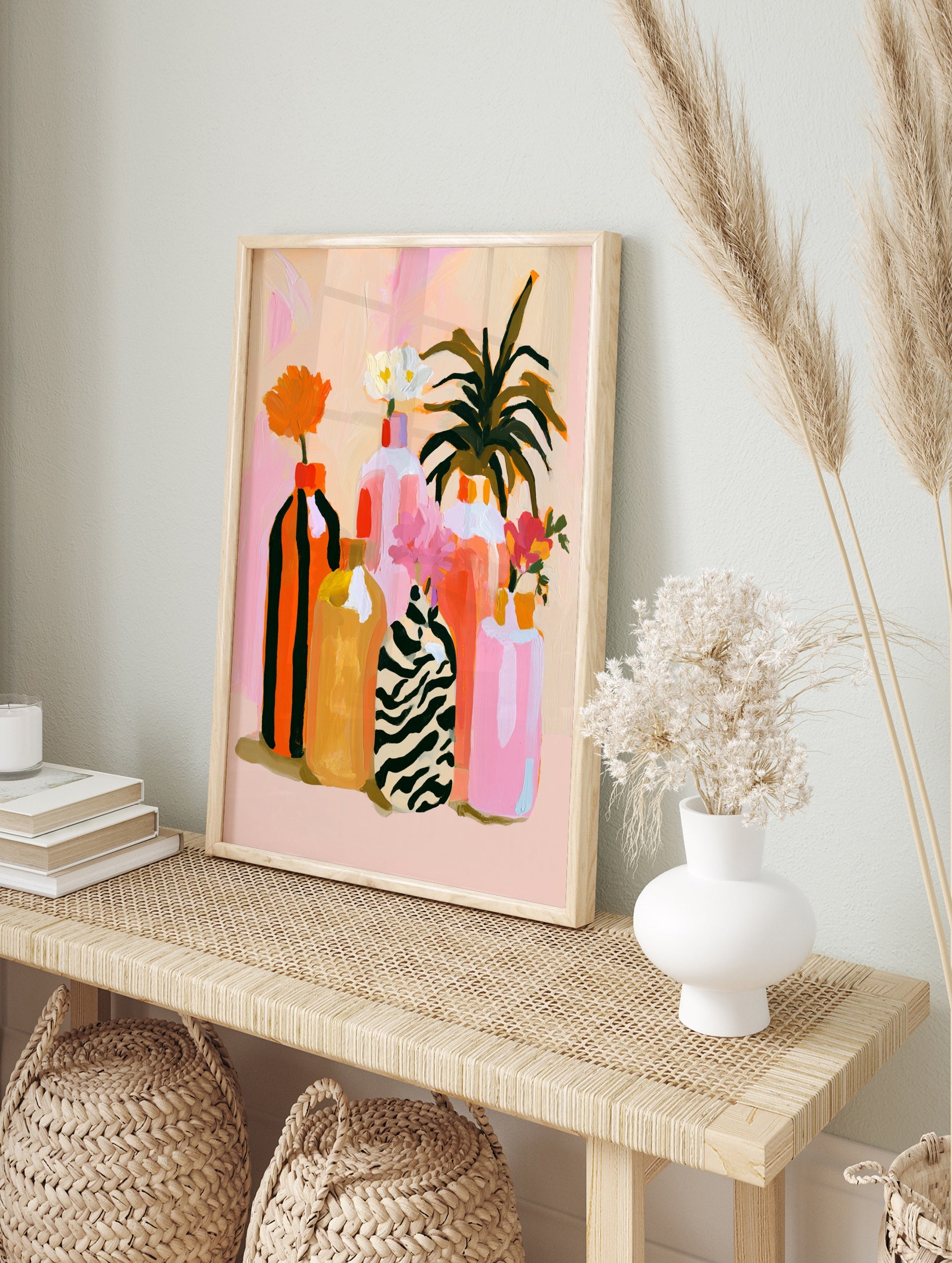 Abstract floral vase wall art with zebra print and striped bottles on a soft pink background, in an alternate framed mockup