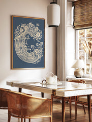 Cream floral wave botanical art print on a deep blue background, unframed, in a styled room mockup