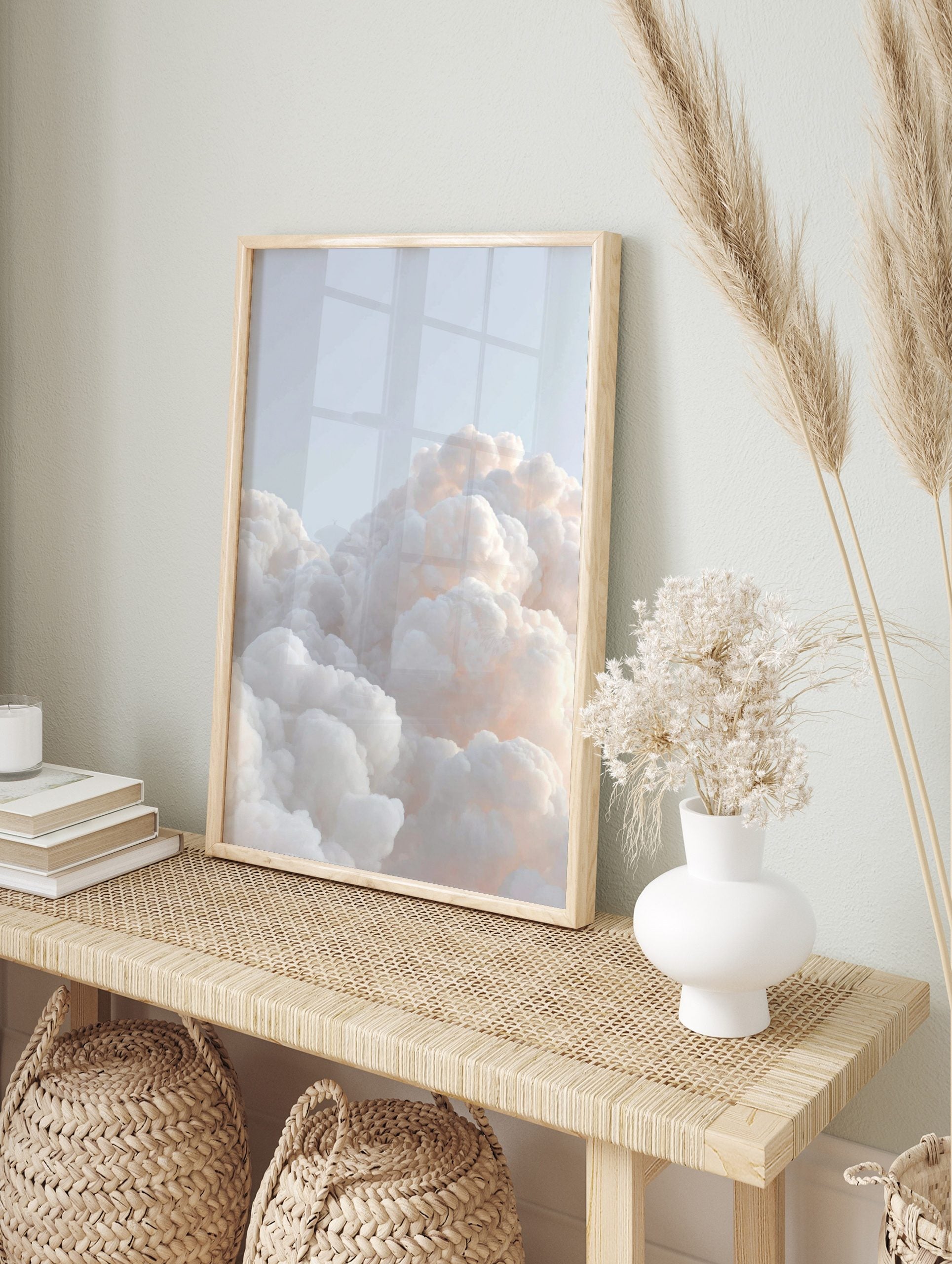 Close-up of fluffy white and pale orange clouds against a light blue sky, creating a serene, in an alternate framed mockup