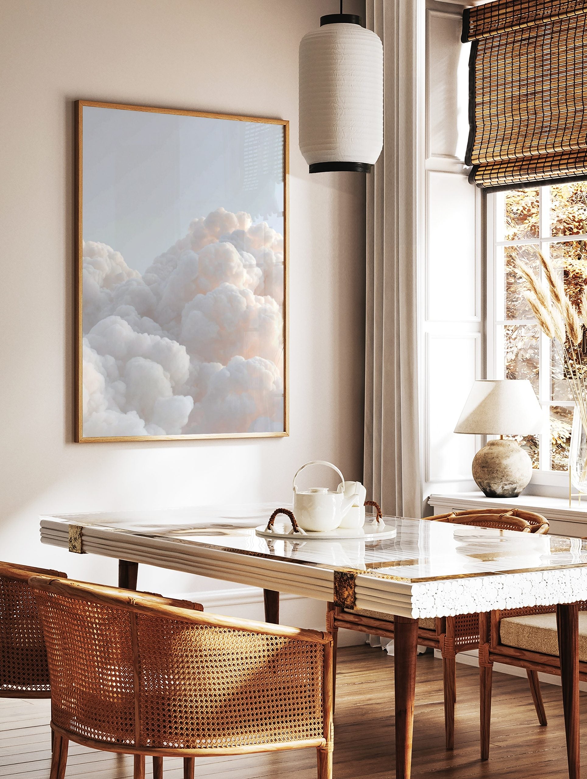 Close-up of fluffy white and pale orange clouds against a light blue sky, creating a serene, in a styled room mockup