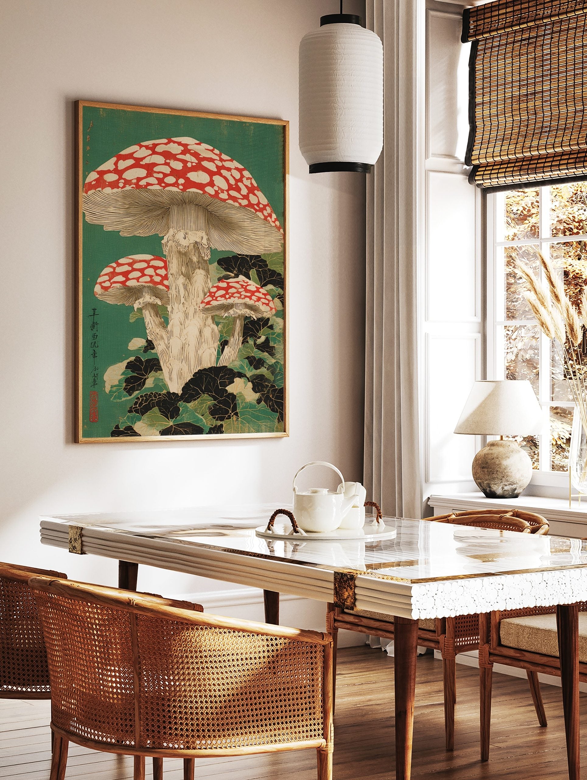 Japanese woodblock print of three red and white spotted fly agaric mushrooms with dark green leaves, in a styled room mockup