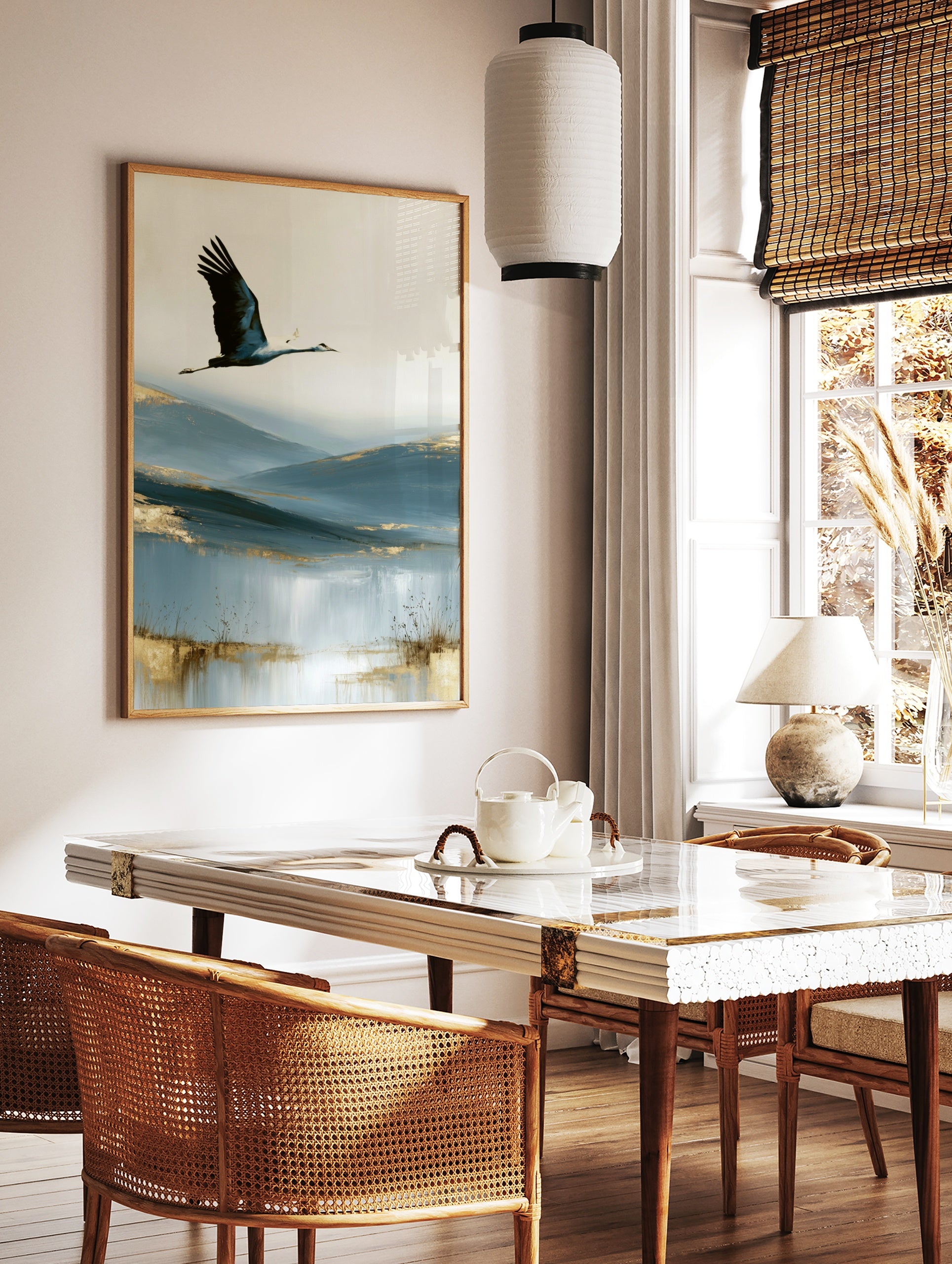 A crane in flight over abstract blue hills with golden accents, an artistic wall art print on paper, in a styled room mockup