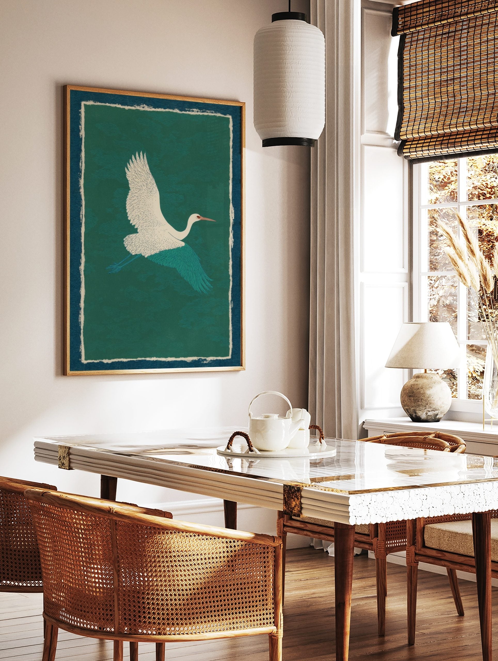 Illustrative white crane with teal wings flying against a textured dark green background, with dark, in a styled room mockup