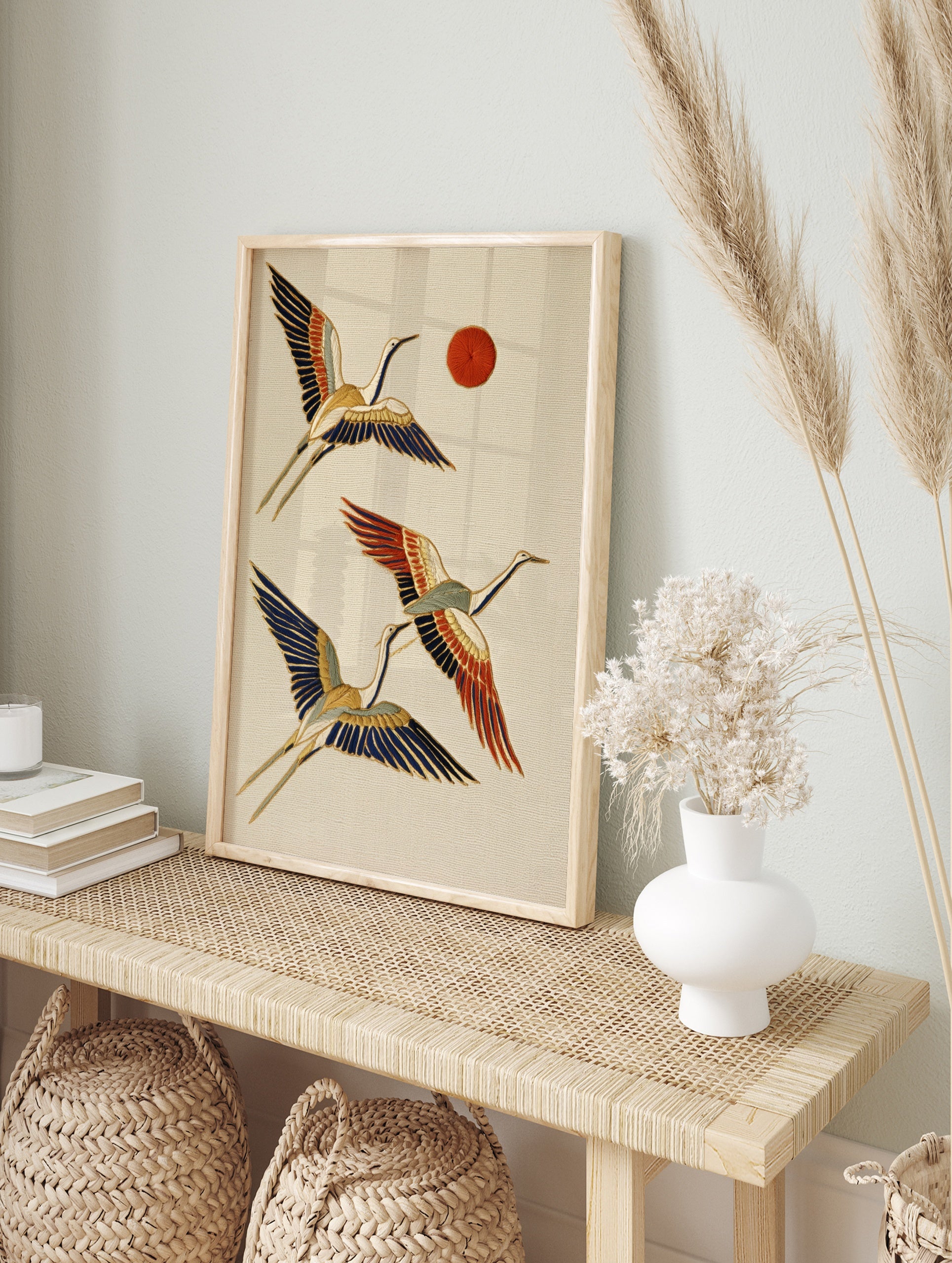 Japanese-style flying cranes wall art with red sun, blue, orange, and gold details on a cream, in an alternate framed mockup