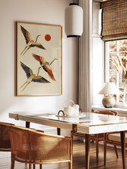 Japanese-style flying cranes wall art with red sun, blue, orange, and gold details on a cream, in a styled room mockup