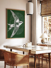 White illustrative swallow bird in flight on a dark green background with radiating lines, in a styled room mockup