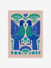 Symmetrical folk art print of two blue and green birds with heart chests and botanical motifs on a pink background