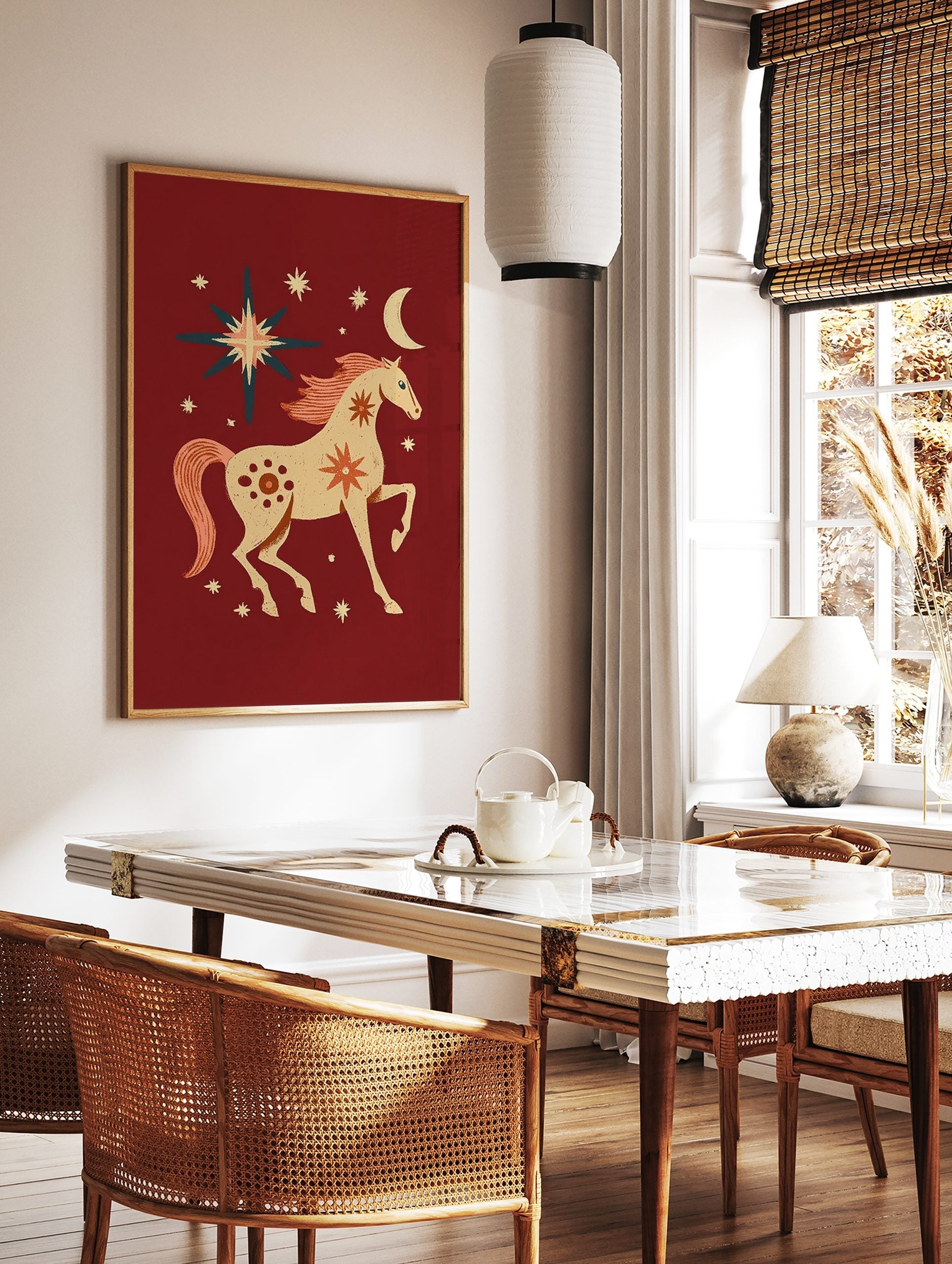 Folk art illustration of a cream horse with coral mane and tail, surrounded by stars and a crescent, in a styled room mockup