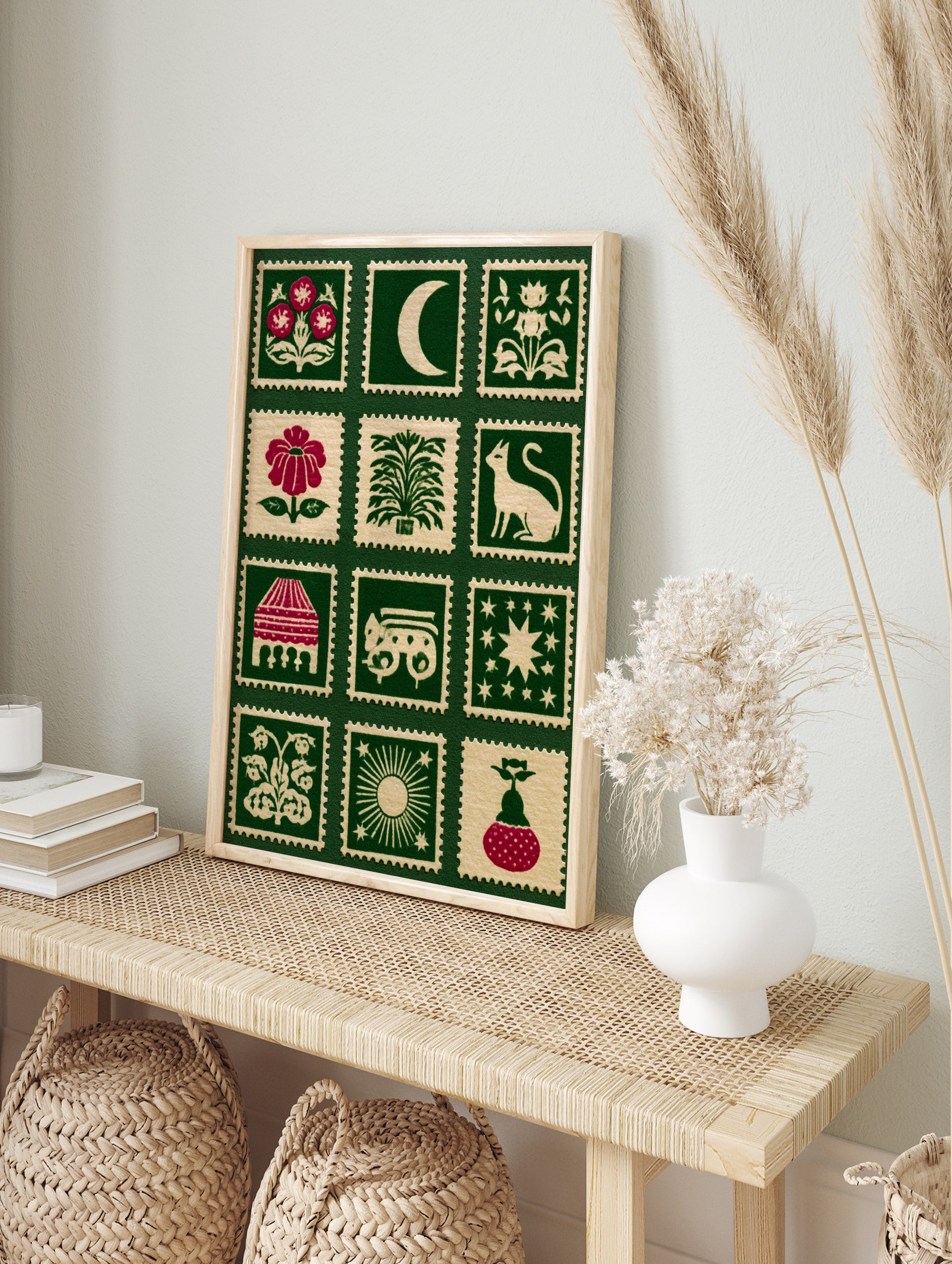 Folk art style stamp grid print featuring botanical flowers, celestial moons, and animals on, in an alternate framed mockup