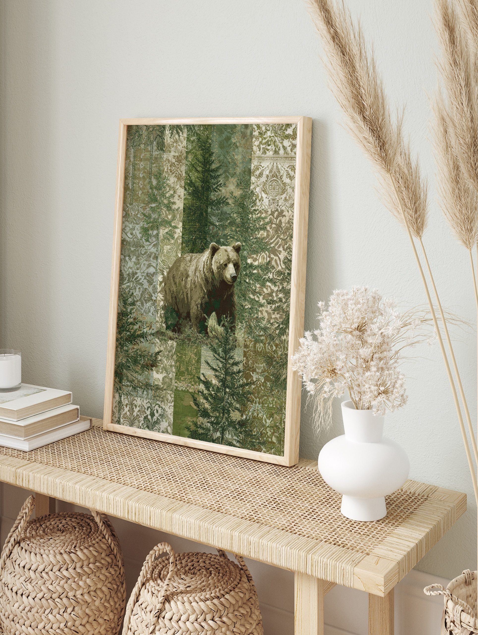 Brown bear standing among green pine trees with a patterned patchwork background in muted, in an alternate framed mockup