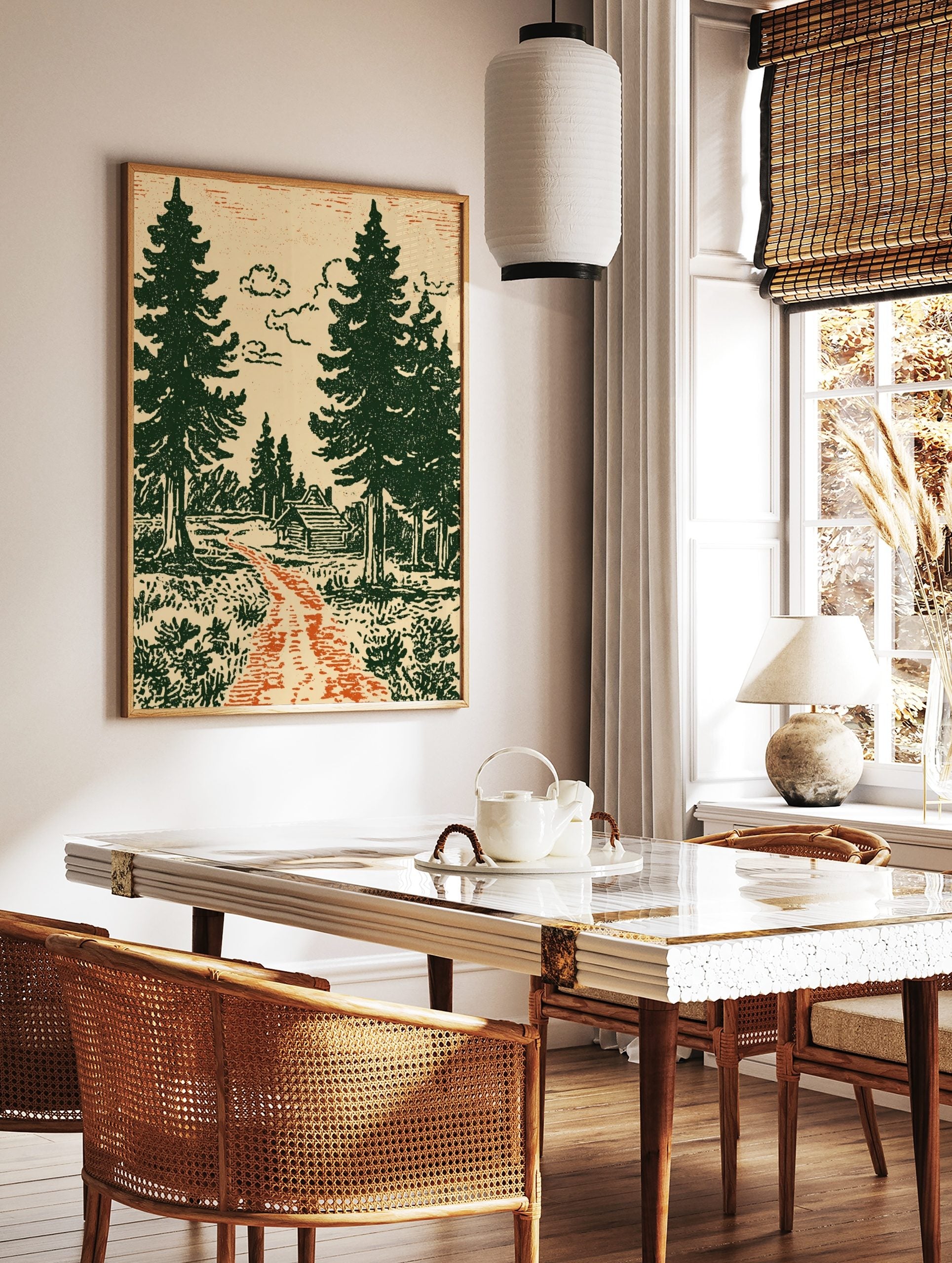 Illustrative forest scene with a log cabin, green pine trees, orange path, and cream sky, in a styled room mockup