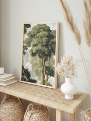 Watercolour forest canopy art print with tall green trees, visible brown trunks, and a misty, in an alternate framed mockup