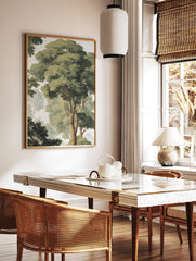 Watercolour forest canopy art print with tall green trees, visible brown trunks, and a misty, light, in a styled room mockup