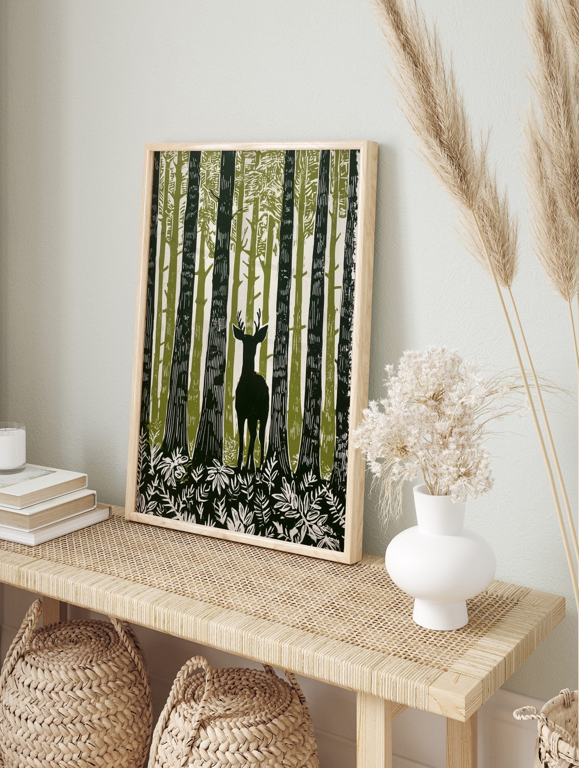 Illustrative forest deer wall art with a stag among tall green and white trees and foliage, in an alternate framed mockup