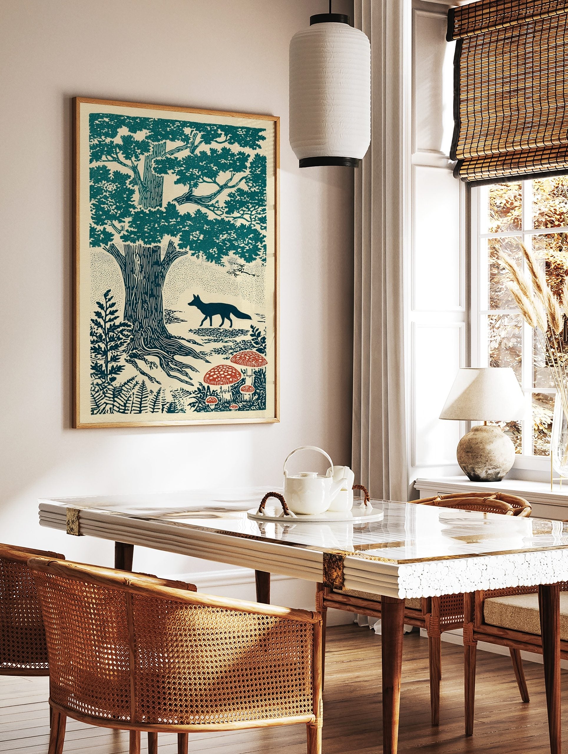 Illustrative forest scene with a dark teal fox walking past large trees and red spotted mushrooms, in a styled room mockup