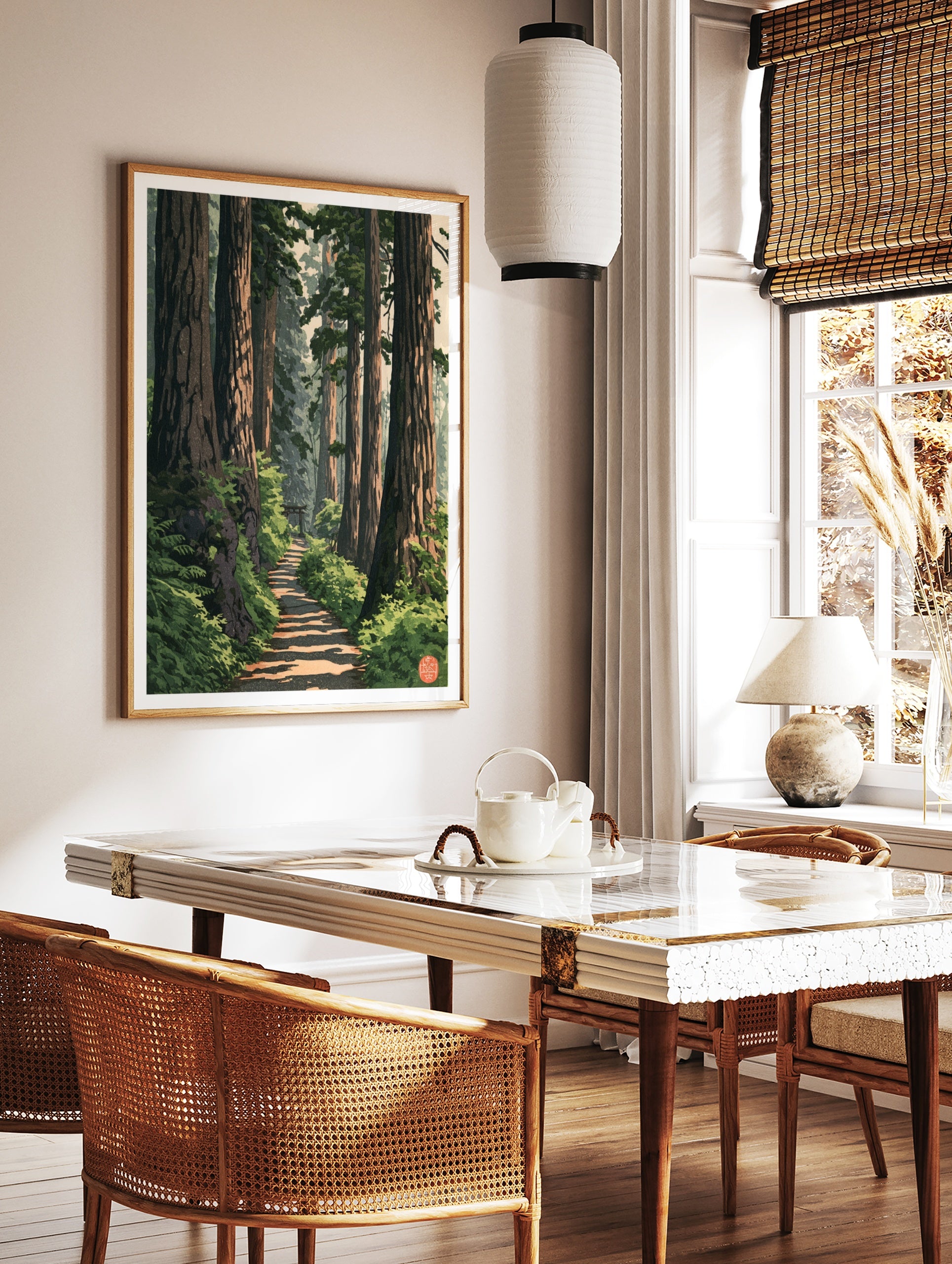 Forest path wall art with a distant torii gate, towering trees, and ferns in an illustrative, in a styled room mockup