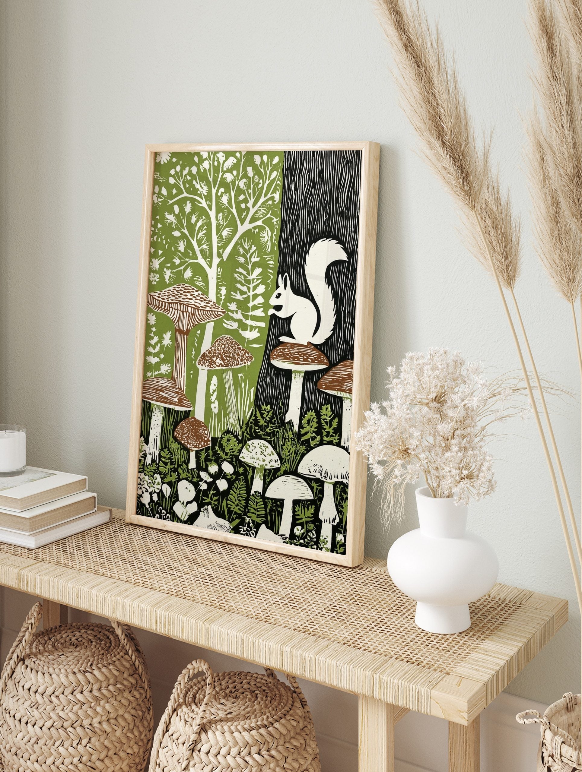 White squirrel on mushroom in a green and black forest woodcut style art print, in an alternate framed mockup