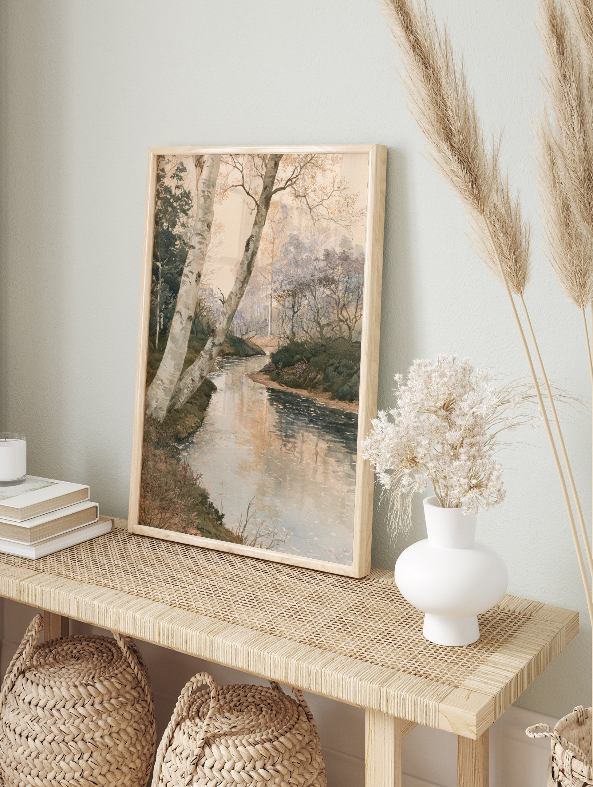 Watercolor style forest landscape painting with a winding stream and birch trees in the, in an alternate framed mockup