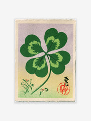 Four-leaf clover botanical illustration in Japanese style with calligraphy, red seal, and floral sprigs on gradient
