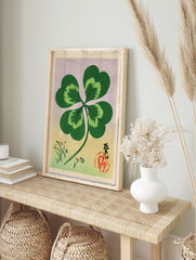 Four-leaf clover botanical illustration in Japanese style with calligraphy, red seal, and, in an alternate framed mockup