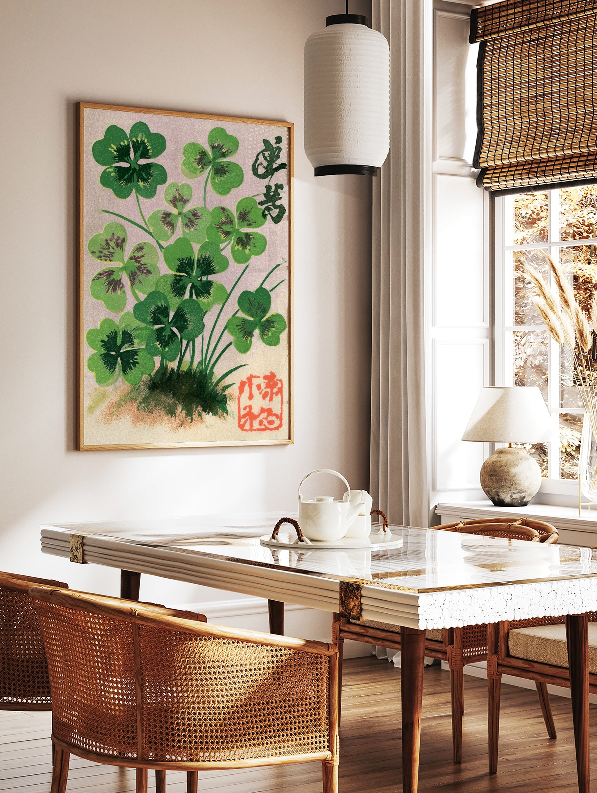 Botanical illustration of four-leaf clovers with Japanese calligraphy and a red seal stamp on a, in a styled room mockup