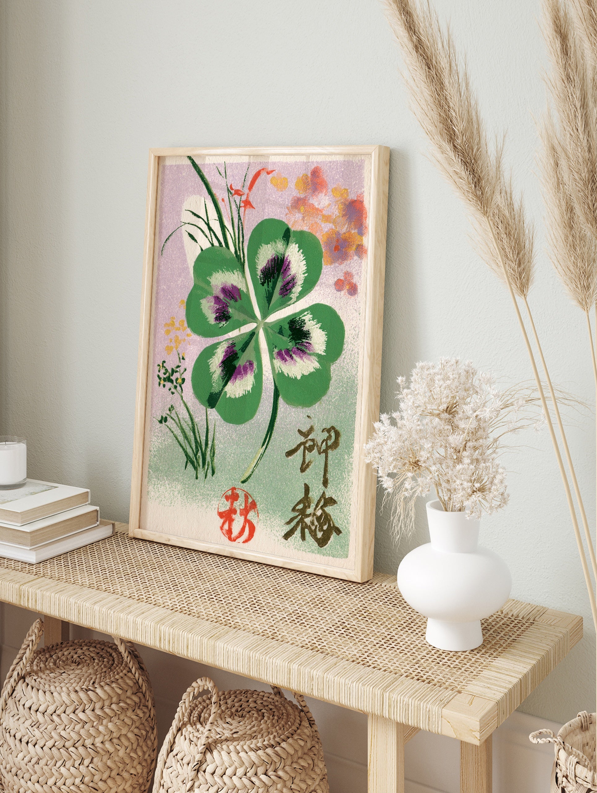 Four-leaf clover botanical illustration with Japanese kanji and red seal on a lilac background, in an alternate framed mockup