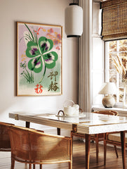 Four-leaf clover botanical illustration with Japanese kanji and red seal on a lilac background, in a styled room mockup