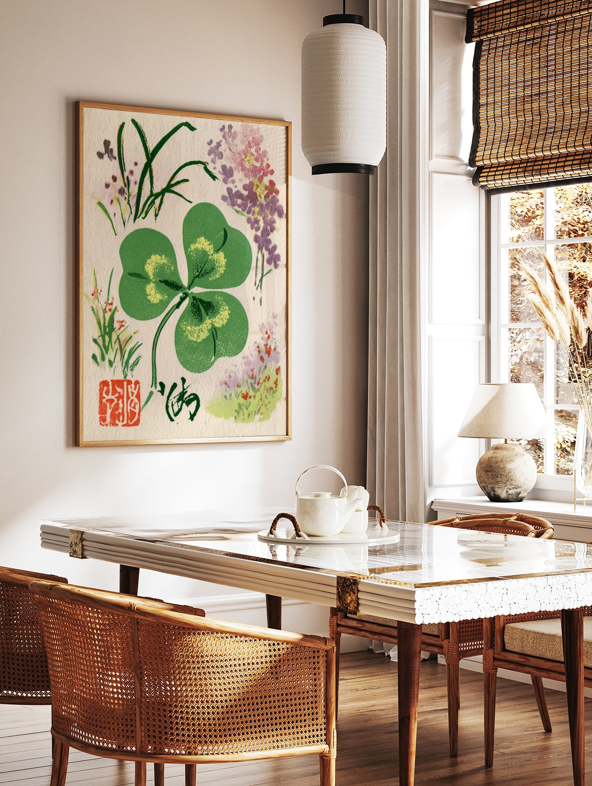 Four-leaf clover botanical illustration with corner flowers, calligraphy, and red seal on paper, in a styled room mockup
