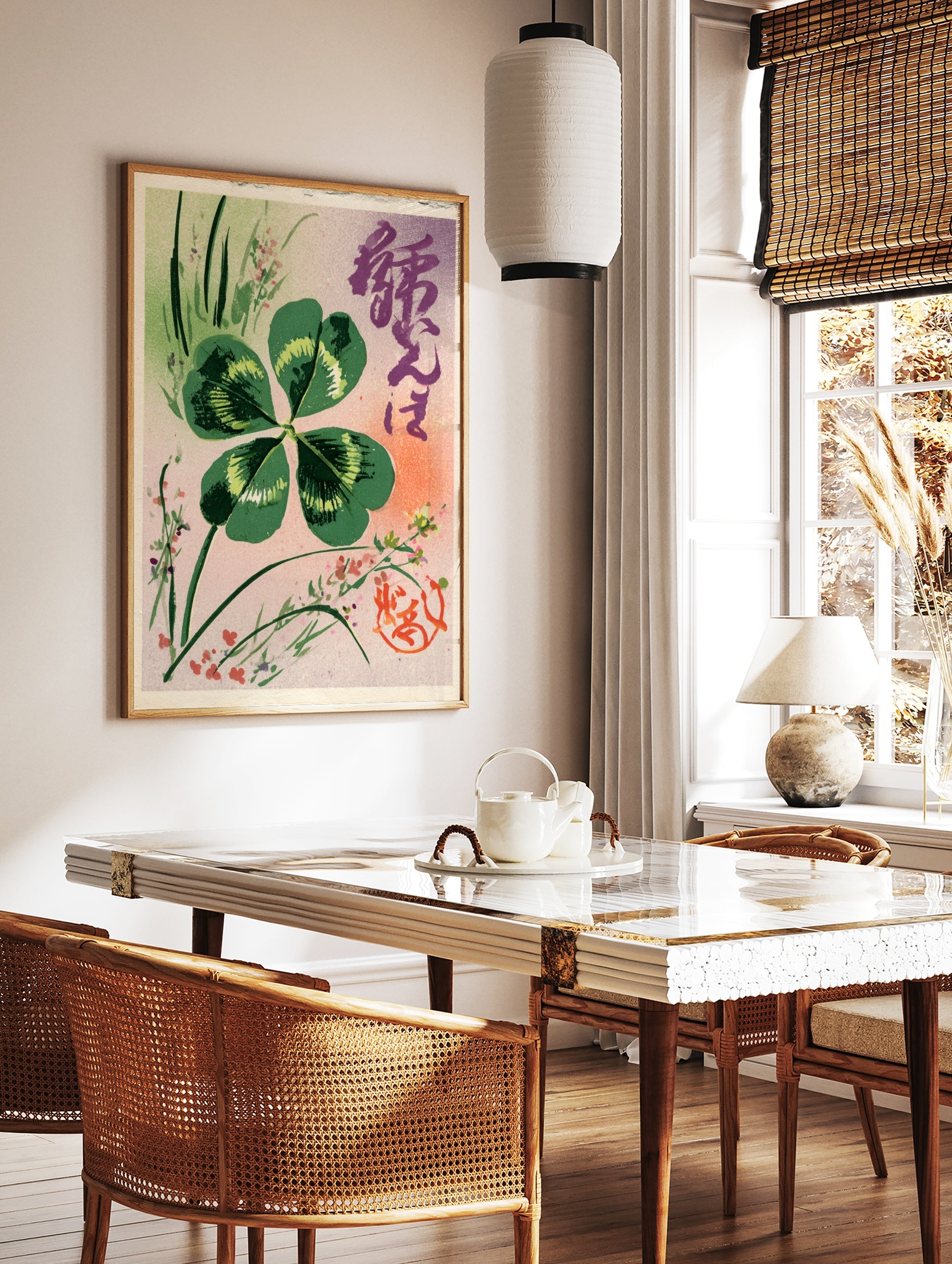 Four-leaf clover botanical illustration with Japanese calligraphy and red seal on pink and lavender, in a styled room mockup