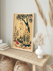 Illustrative fox sitting on a stump with a lantern and red fruit, woodland art print on cream, in an alternate framed mockup