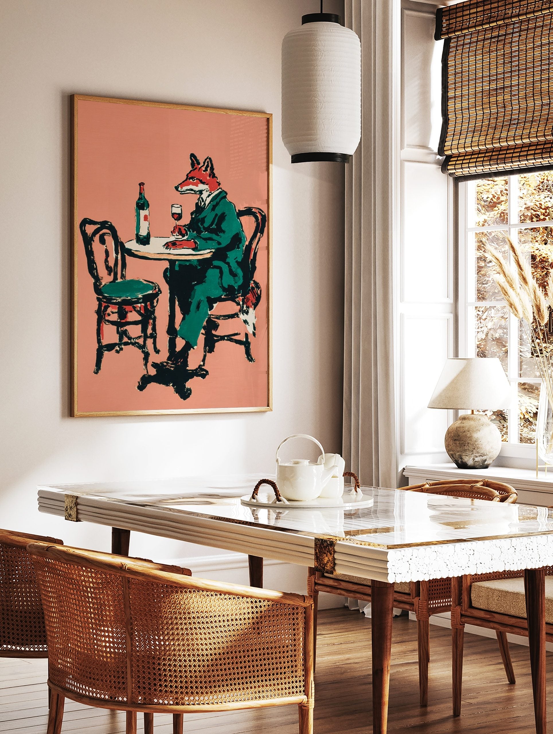 Illustrative print of a fox in a green suit sitting at a table with a bottle and glass of red wine, in a styled room mockup