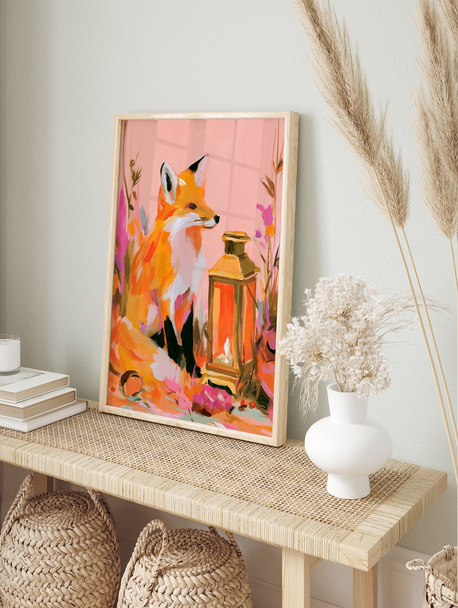 Illustrative fox sitting next to a glowing lantern with colourful abstract flowers, pink and, in an alternate framed mockup