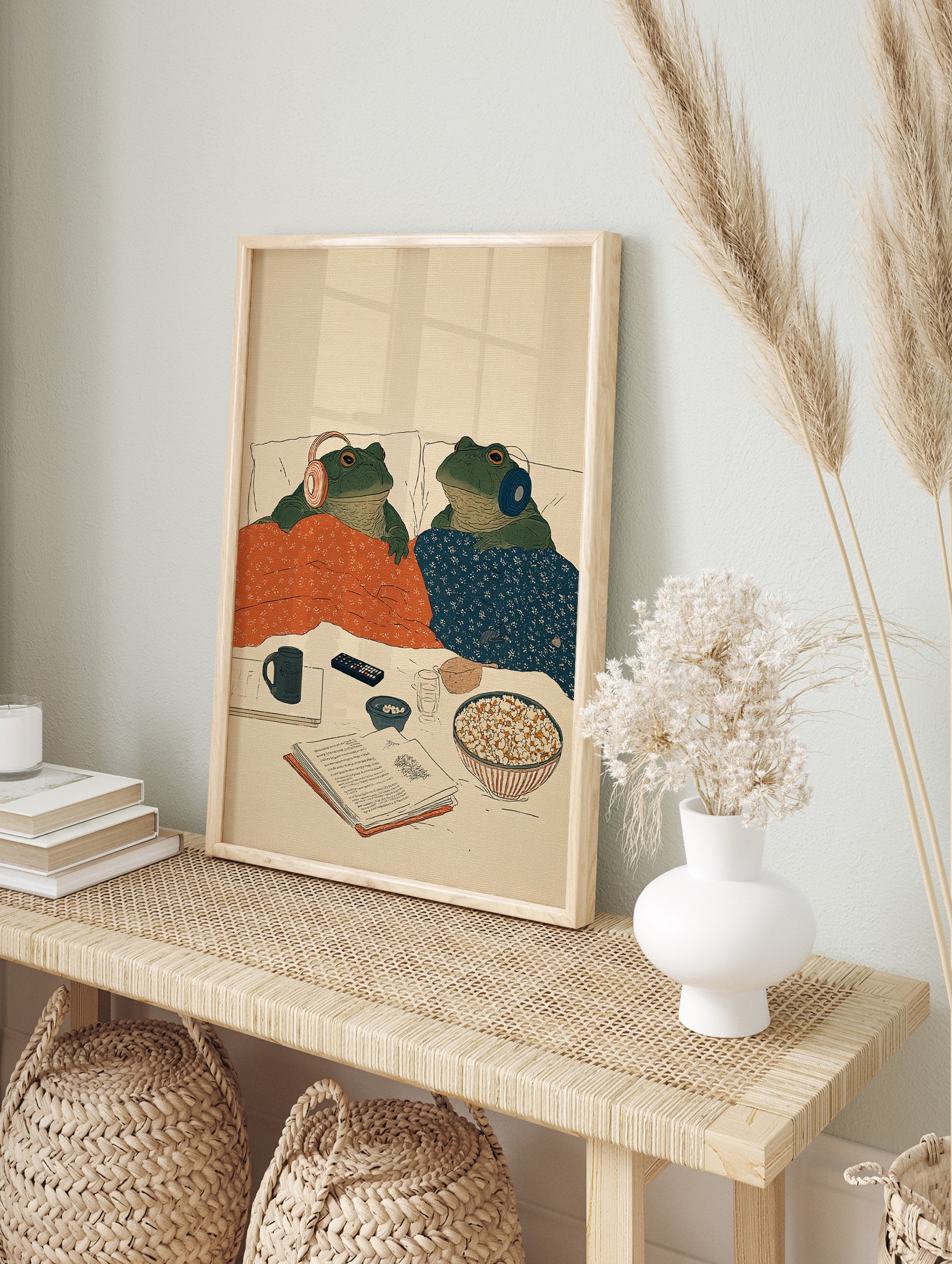 Illustration of two green frogs in bed with headphones, blankets, popcorn, and a book. Cozy frog art print. - Image 3