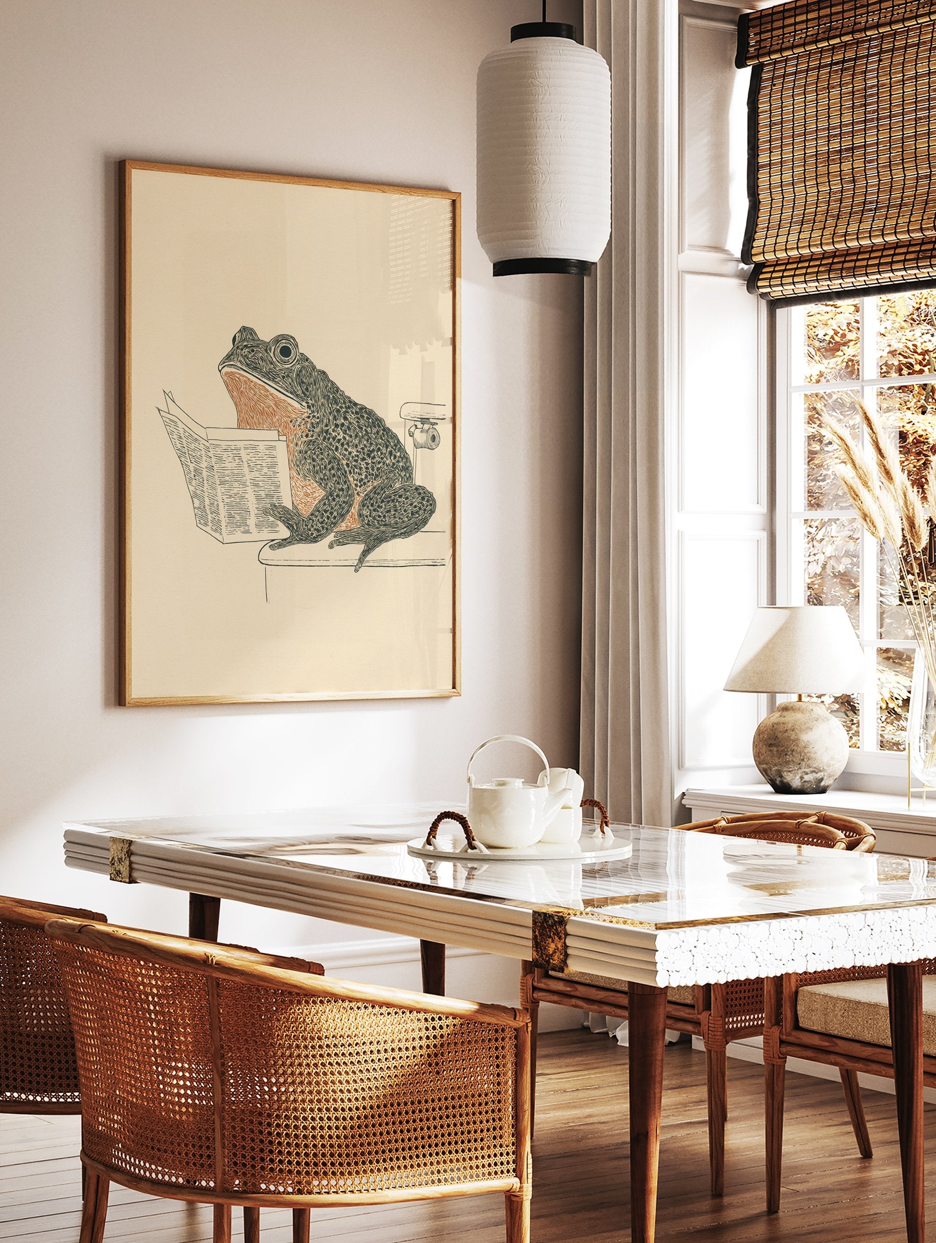 Humorous frog art print showing a frog sitting on a toilet reading a newspaper, in black, orange, and beige tones. - Image 2