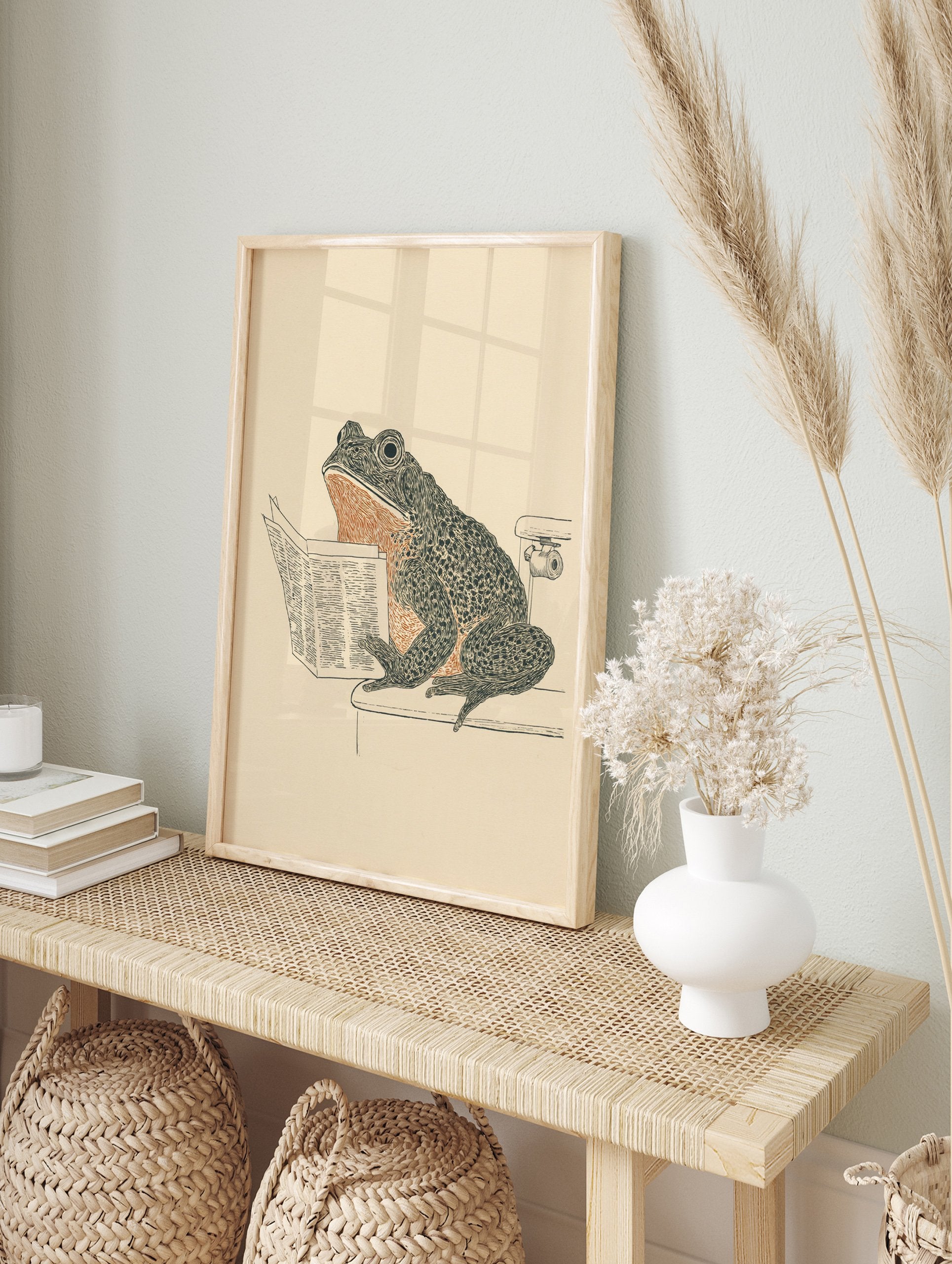 Humorous frog art print showing a frog sitting on a toilet reading a newspaper, in black, orange, and beige tones. - Image 3
