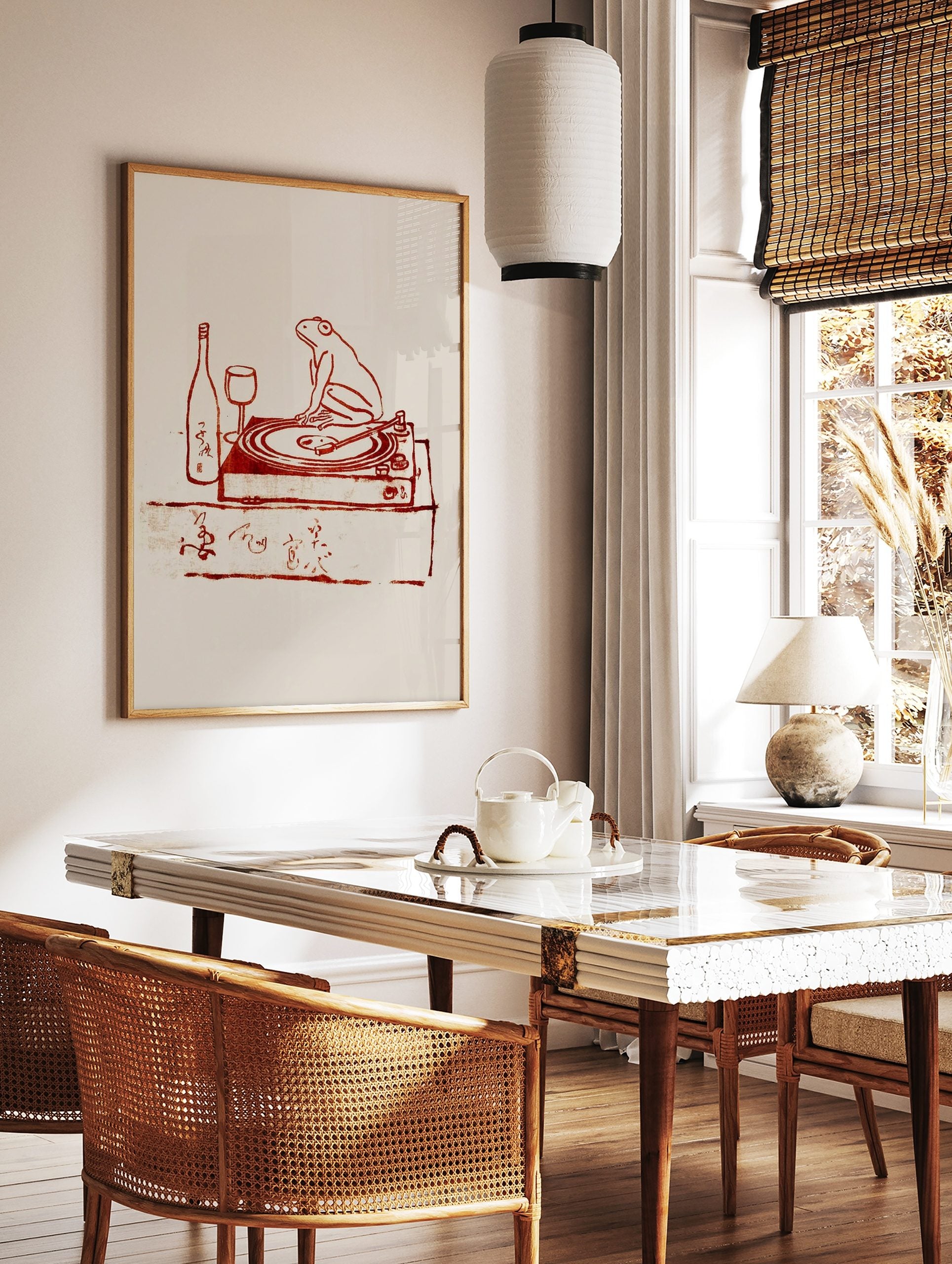 Reddish-brown illustration of a frog on a turntable with a wine bottle, glass, and Japanese script, in a styled room mockup