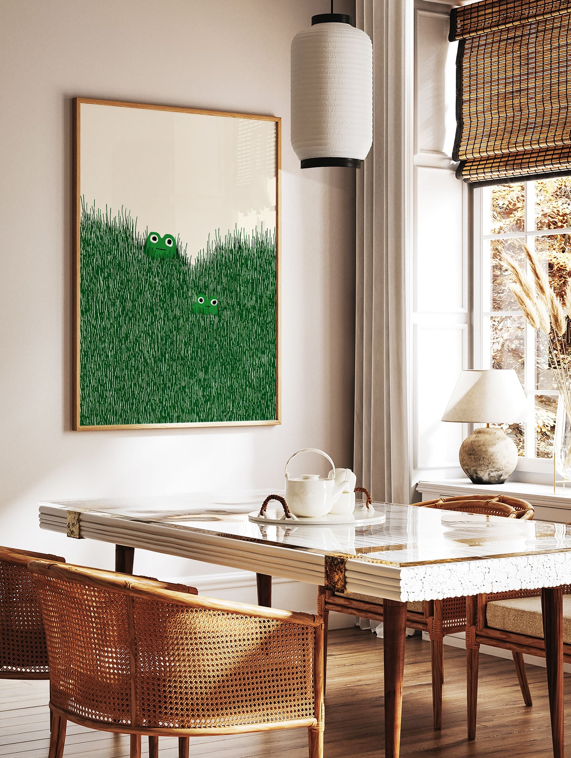 Illustrated frog wall art with two green frogs peeking out of tall green grass on an off-white background. - Image 2