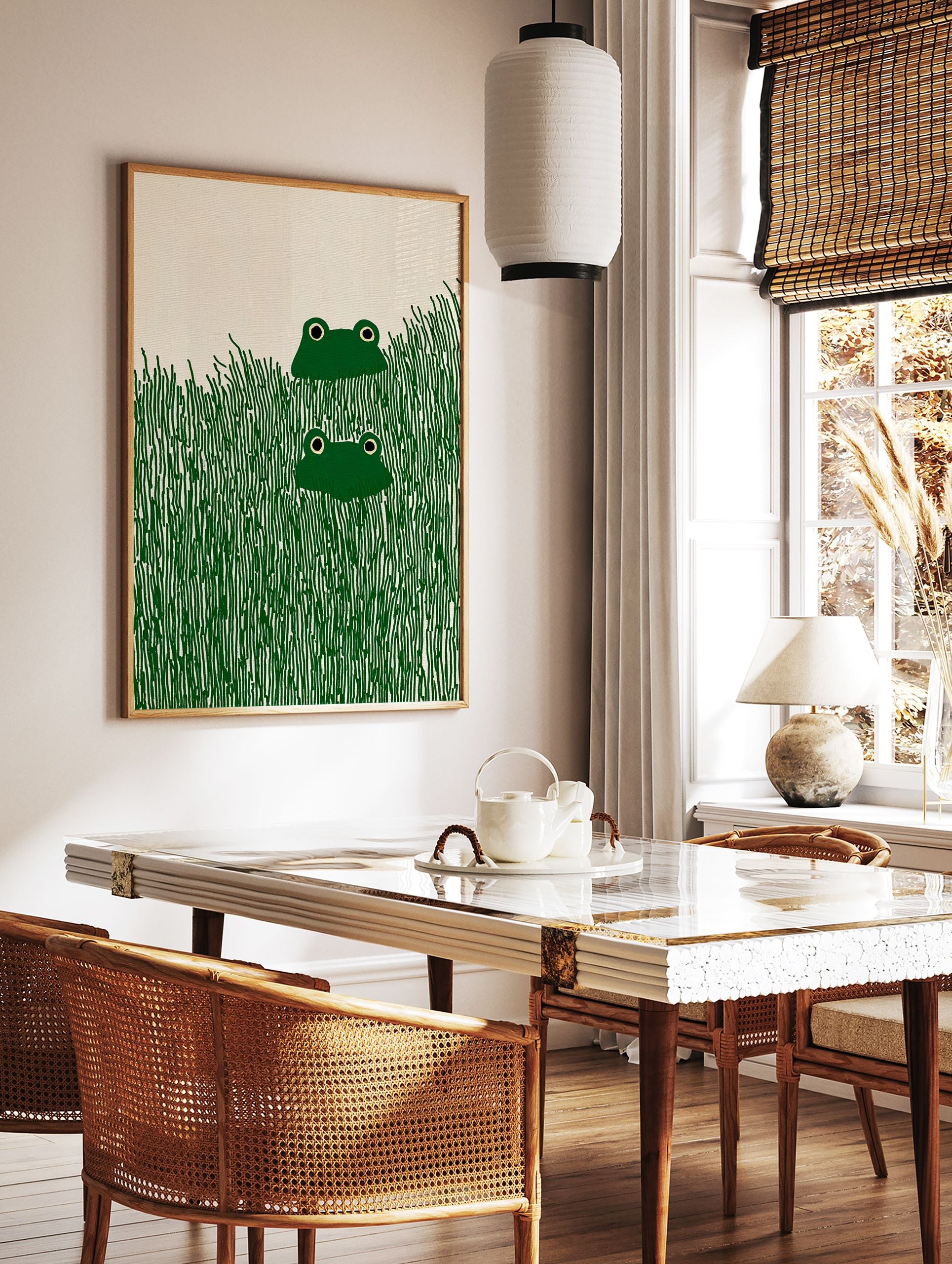 Illustrative frog wall art print featuring two green frogs with black eyes peeking from tall dark green grass. - Image 2