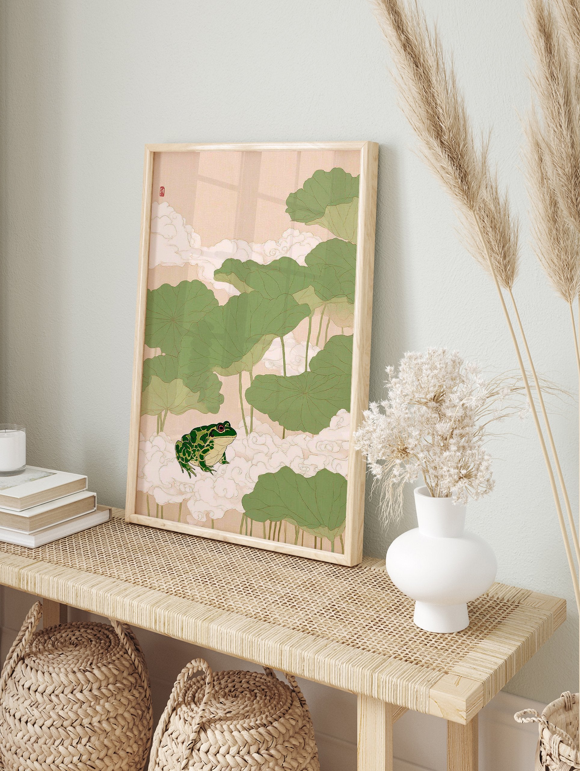 Japanese frog wall art print with a green frog on white clouds surrounded by large green lotus leaves on a light pink background. - Image 3