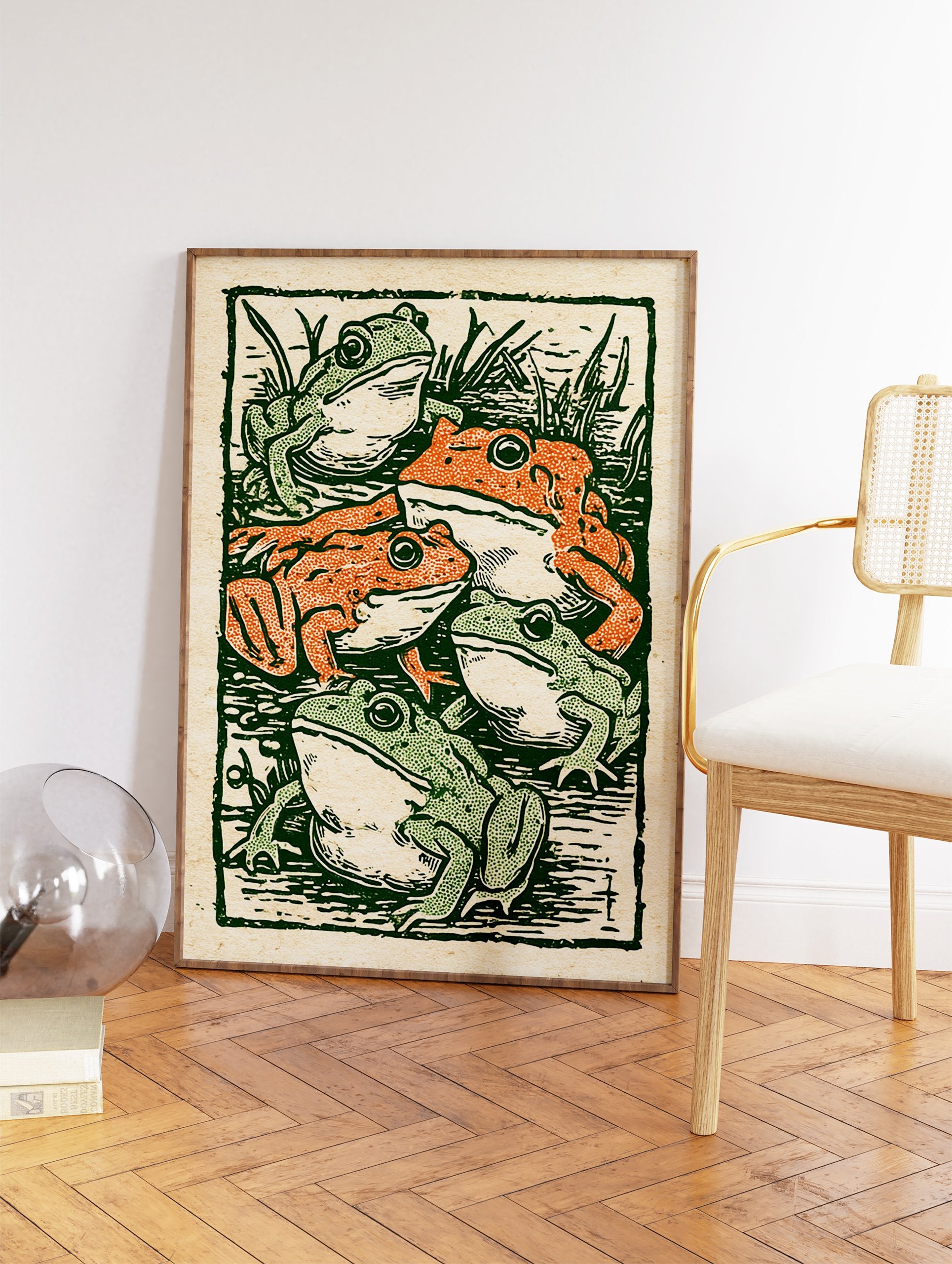 Vintage illustration print showing five green and orange frogs in a pond with reeds, in a woodcut style. - Image 2