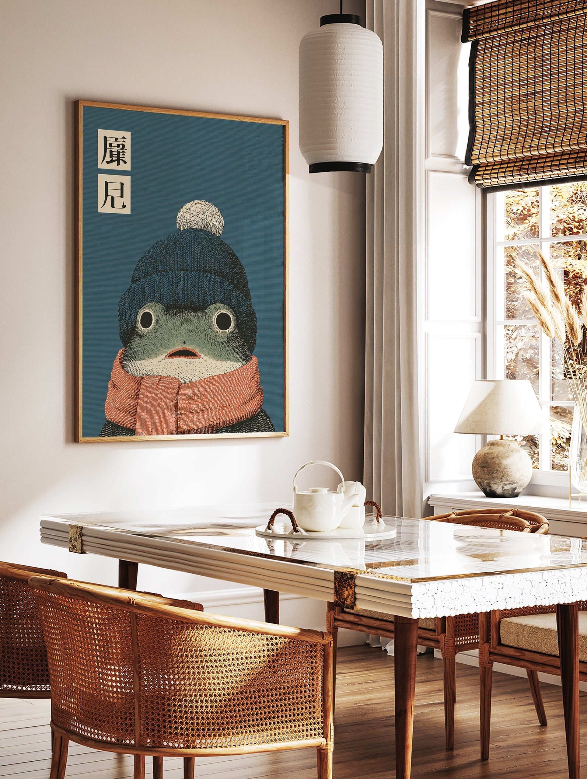 Whimsical frog wall art illustration wearing a blue beanie and orange scarf with Japanese text on a blue background. - Image 2