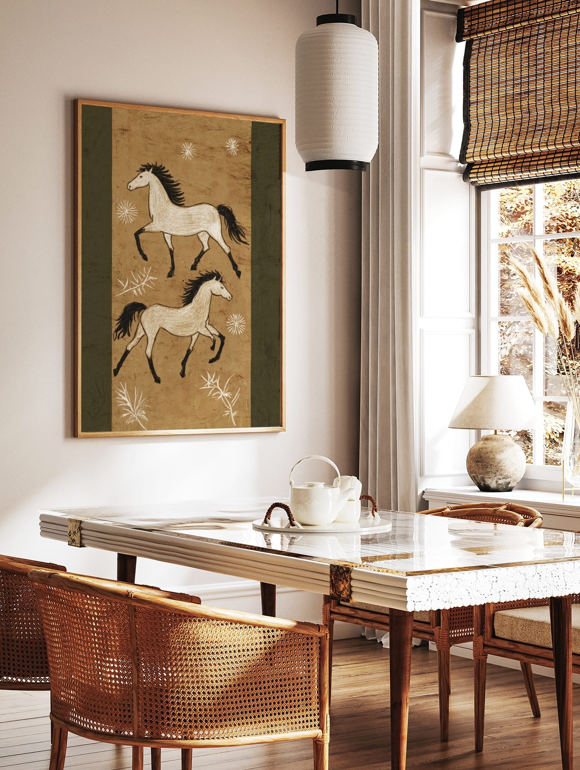 Two illustrative white horses with black manes and tails gallop on a textured tan background with, in a styled room mockup