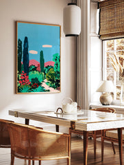 Vibrant garden wall art painting featuring tall trees, green bushes, red flowers, and pink mountains under a blue sky. - Image 2