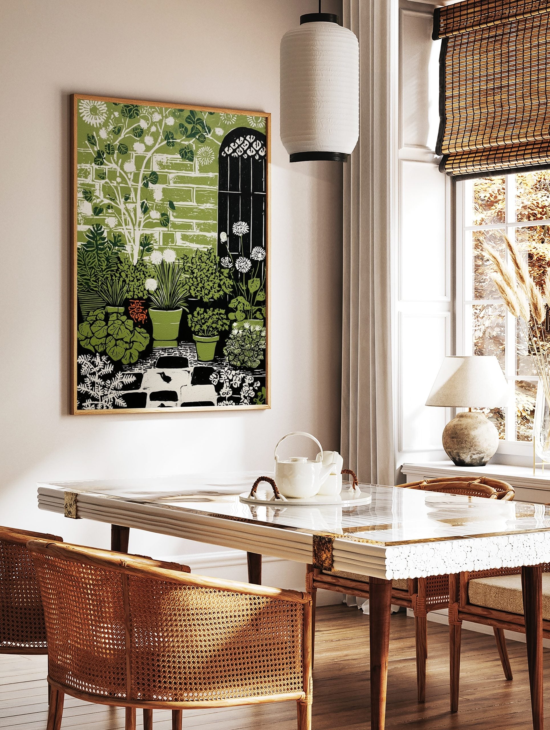 Illustrative green garden art print with potted plants, white dandelions, brick wall, arched gate, in a styled room mockup