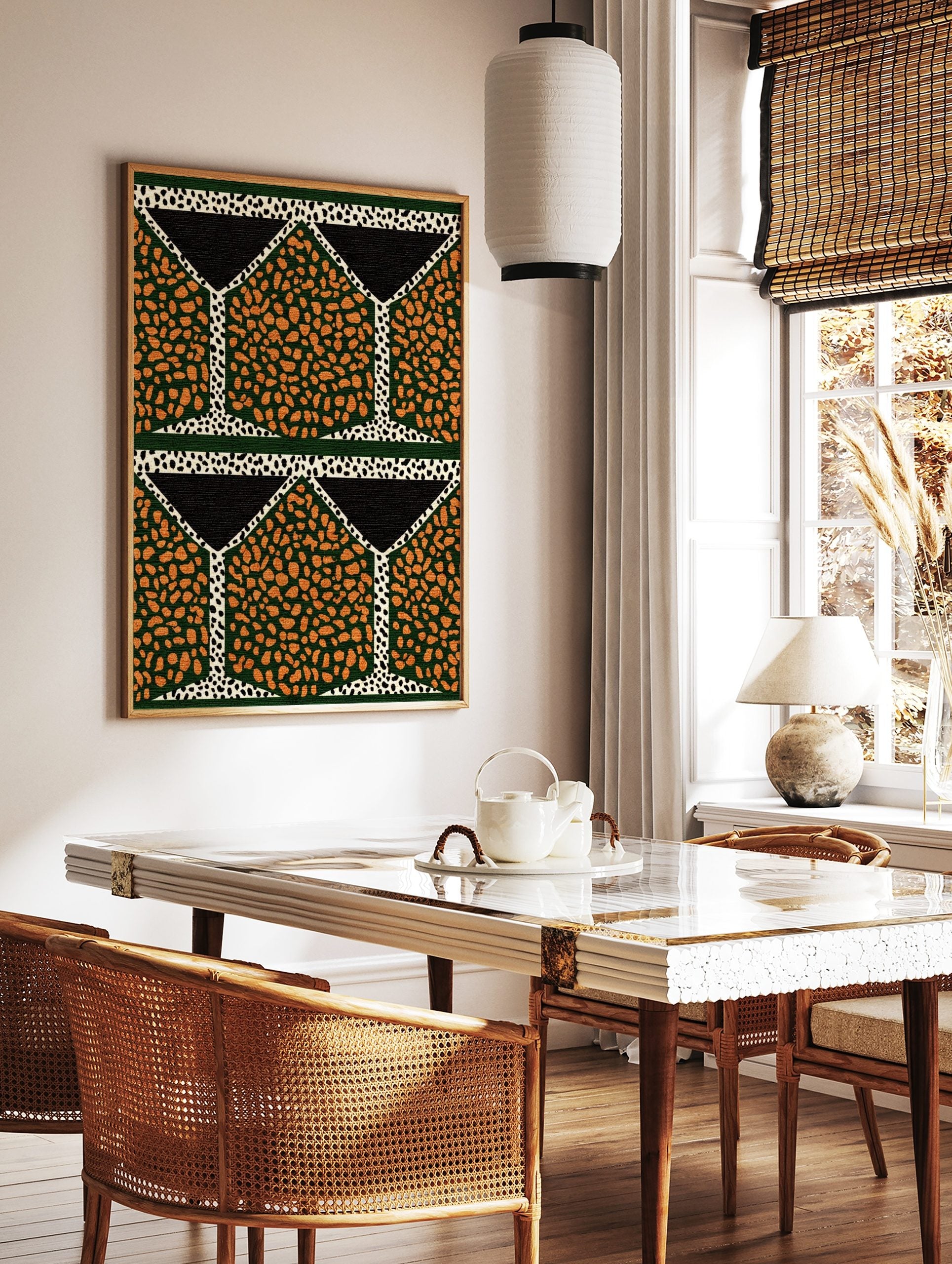 Geometric pattern wall art with orange speckled shapes on dark green, black triangles, and white, in a styled room mockup