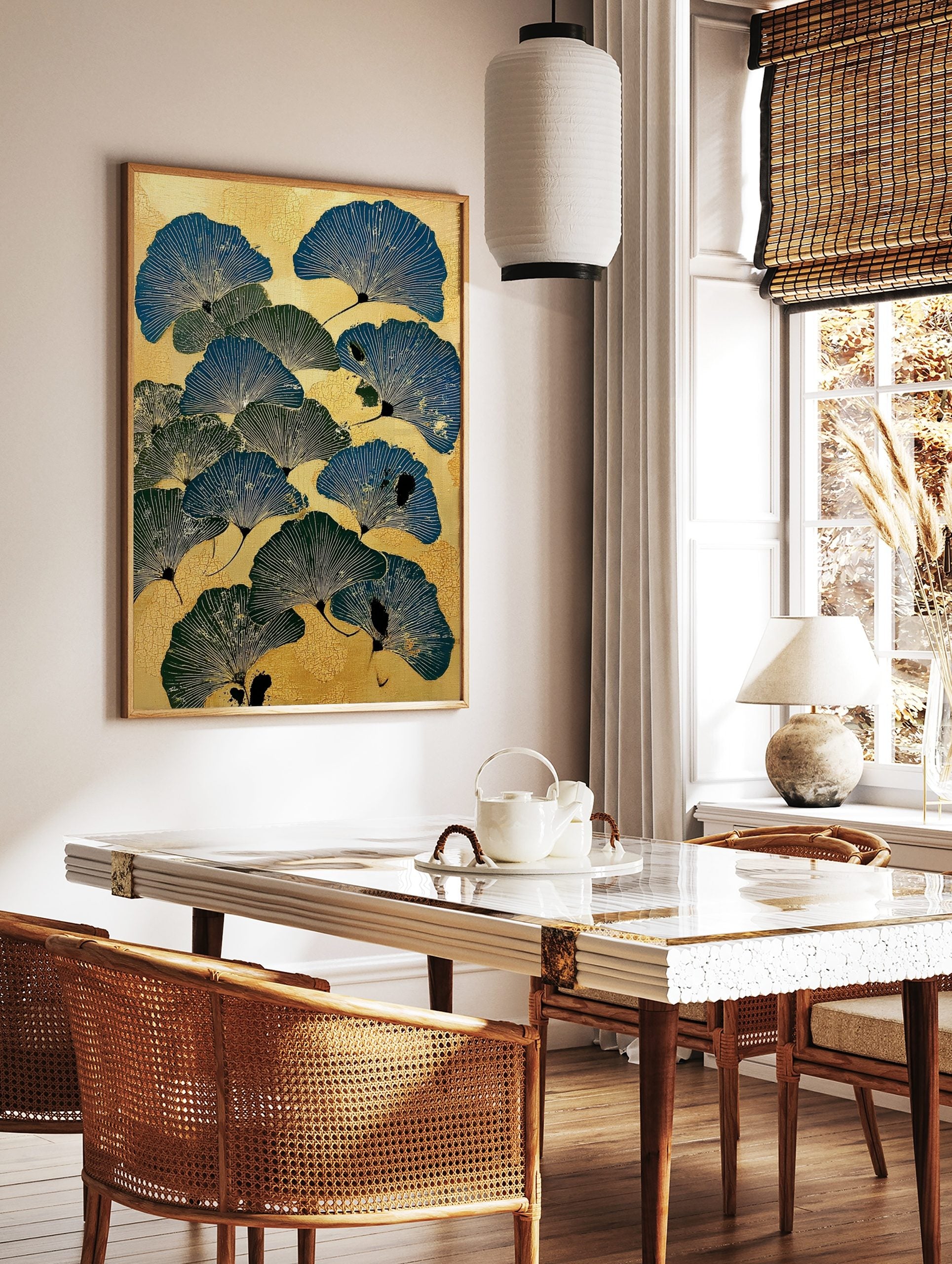 Illustrative ginkgo leaf botanical print in blue and green on a textured golden background, in a styled room mockup